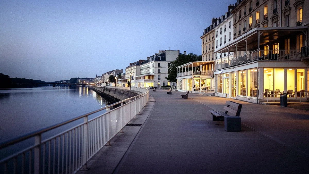 Illustration: Bristol's riverfront lined with lit-up terraces at dusk.