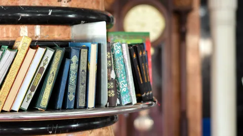 A shelf crowded with thick books of music theory and history.